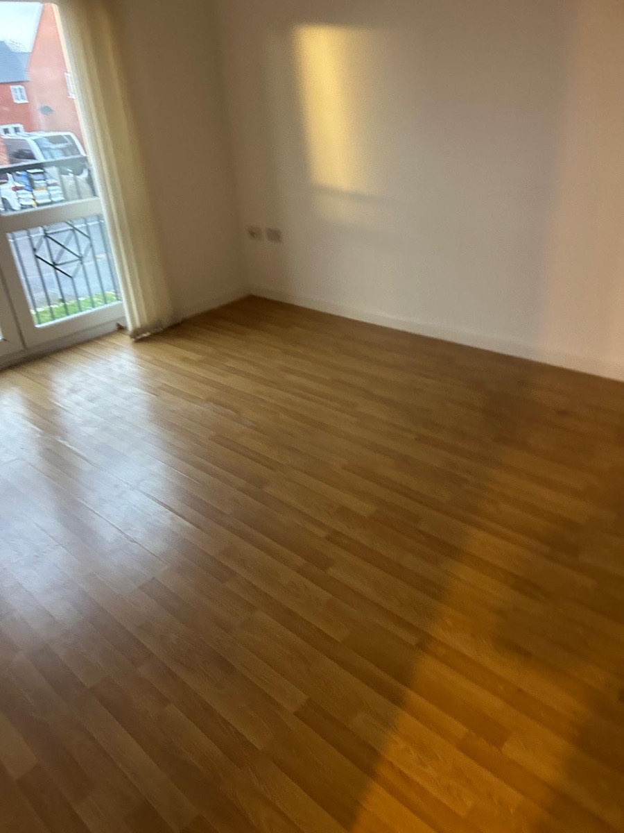 Flat living room cleared and empty, floor swept